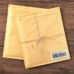 Gift padded envelopes on wooden table